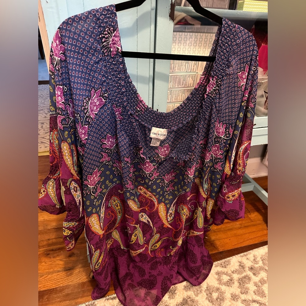 Comfortable silky feel blouse.  Colors are gorgeous!  Elastic around neck/sleeve